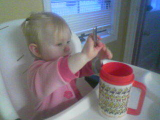 Parker in her high chair on Xmas morning 2005